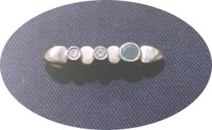 Duo 18ct remount ring with two diamonds and an emerald by Xing Design